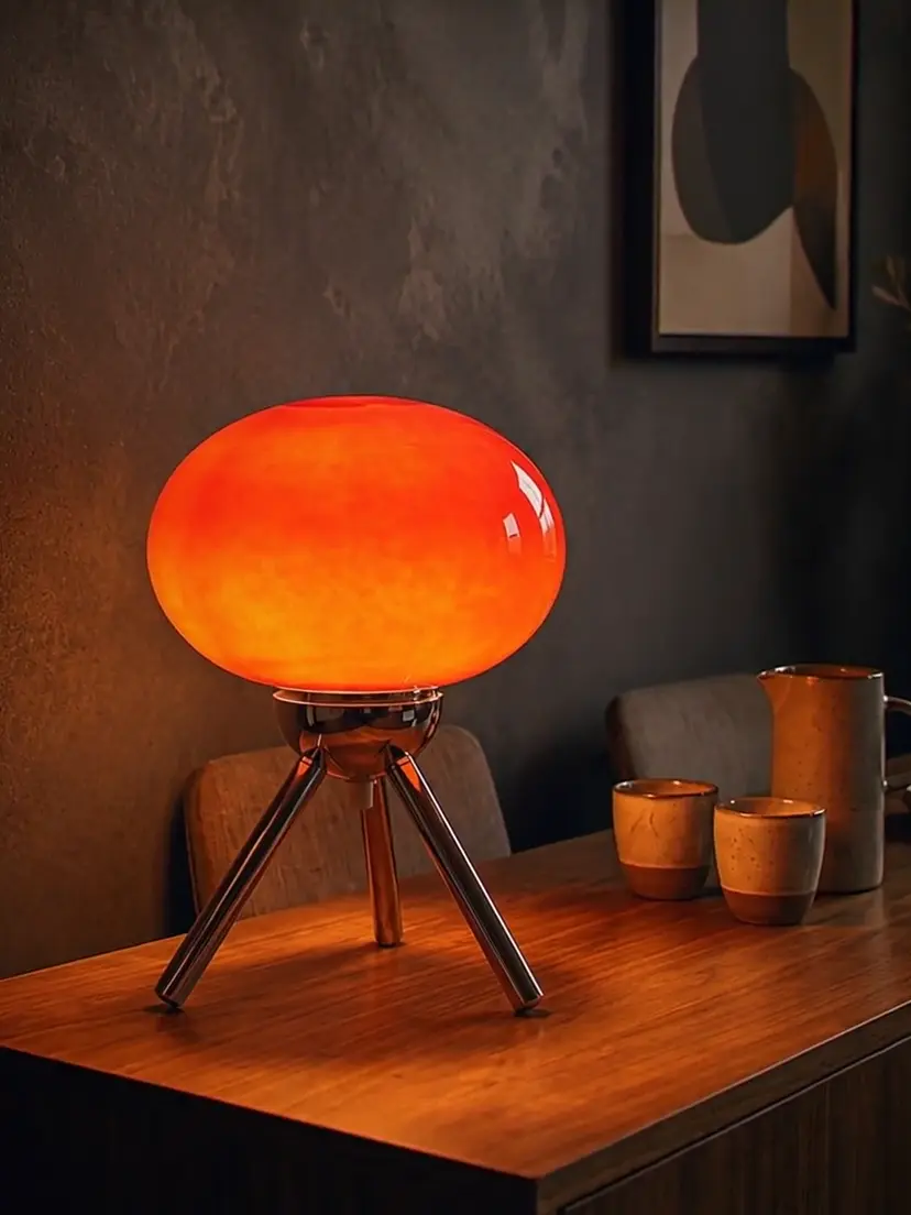 Slow push-in on a lit lamp in an evening interior